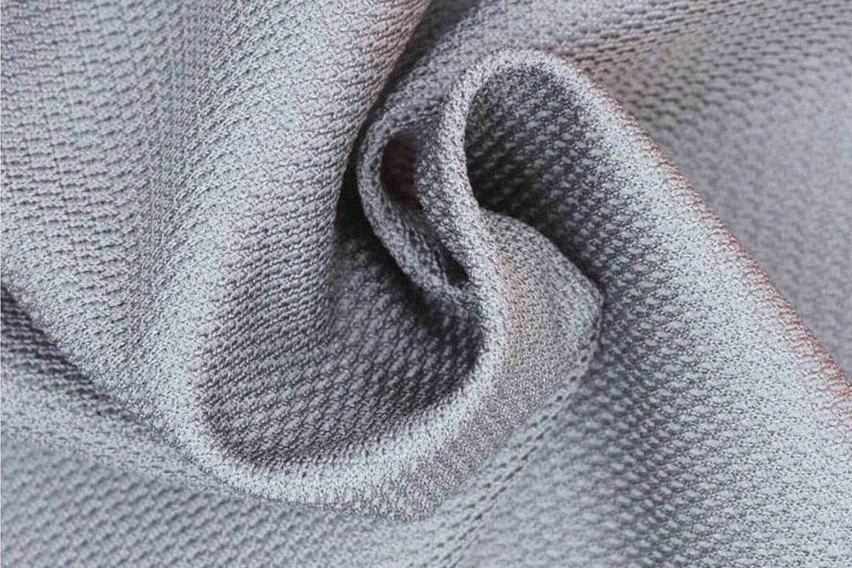ผ้า Pima Cotton Hybrid — 10 ชนิดผ้าพรีเมียมยอดนิยมสำหรับการผลิตเสื้อยืดและเสื้อโปโลปี 2026 ที่โรงงานการ์เม้นท์แนะนำ